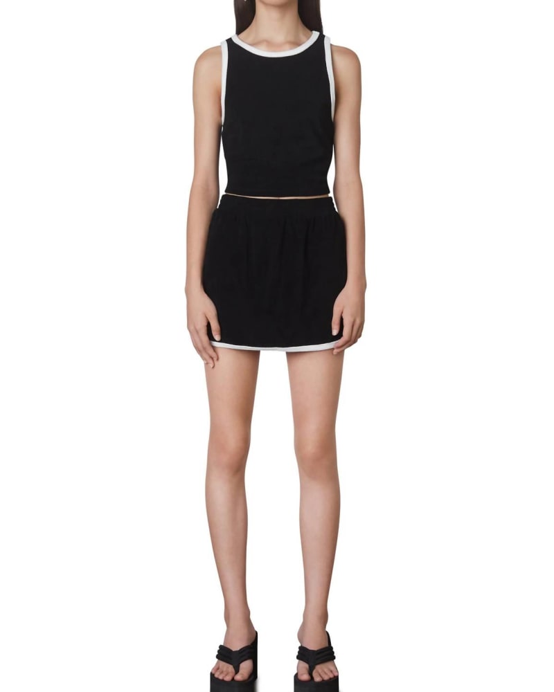 Front of a model wearing a size L Terry Dolphin Skort In Black in Black by NIA. | dia_product_style_image_id:356331